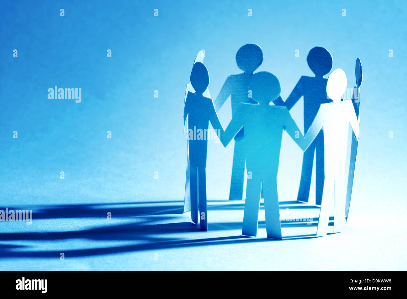 paper team linked together partnership concept Stock Photo