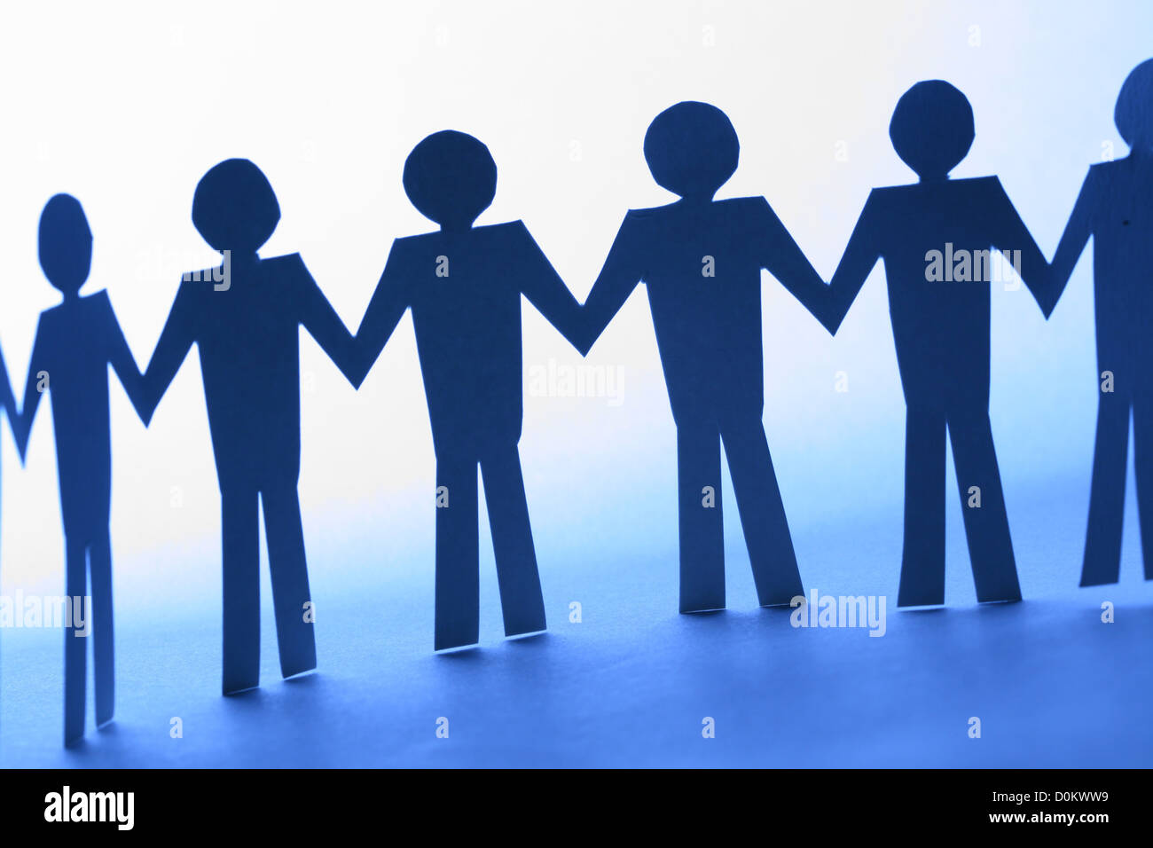 paper team linked together partnership concept Stock Photo