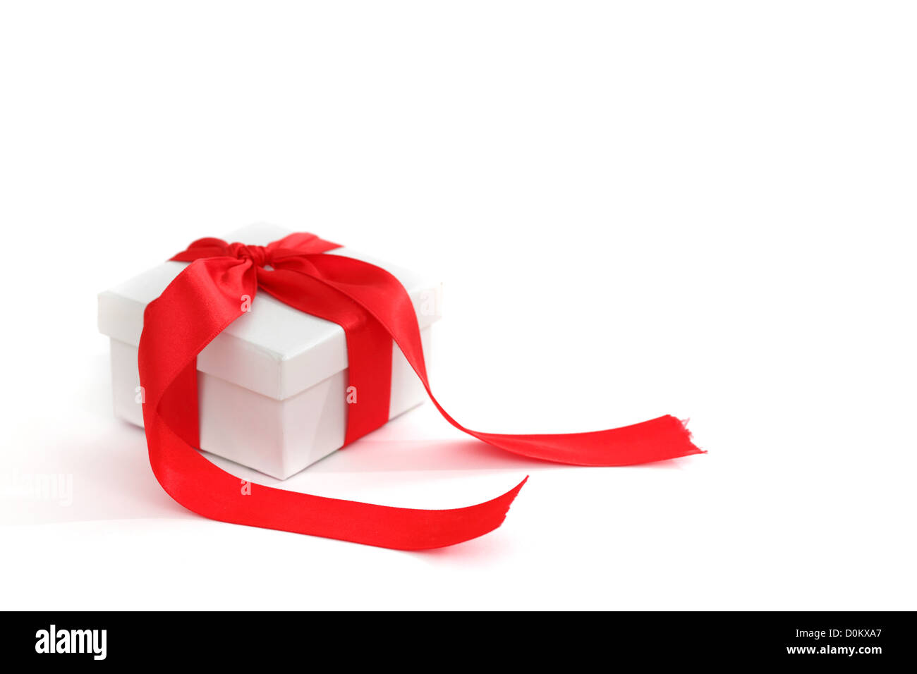 white christmas gift with red ribbon Stock Photo Alamy