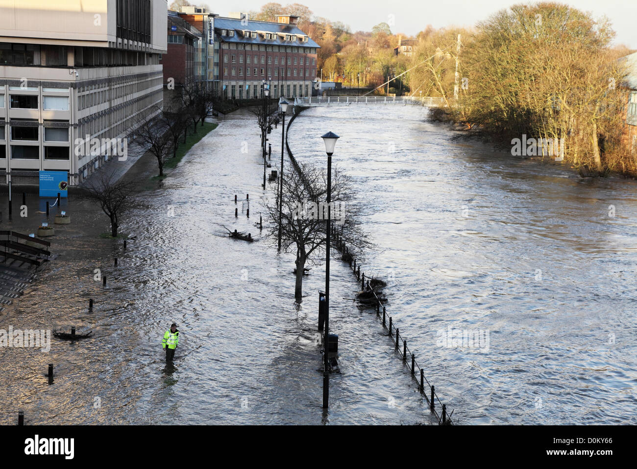Durham, UK. 27th November 2012. Police officer checks depth of flood water as river Wear overflows its banks within Durham City. Credit:  Washington Imaging / Alamy Live News Stock Photo