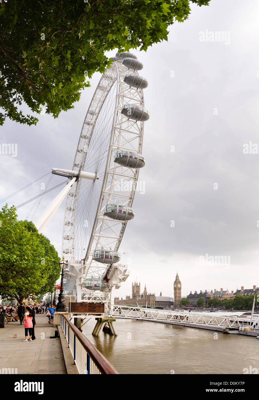 The London Eye on South Bank with the Parliament buildings in the background. Stock Photo