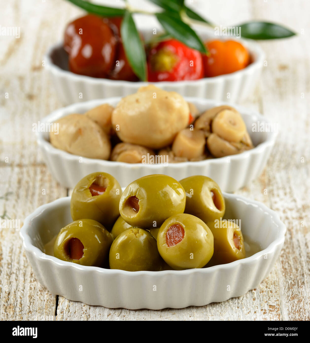 Green Stuffed Olives,Marinated Mushrooms And Sweet Peppers Stock Photo