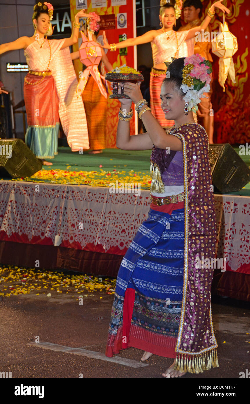 Thai dancing performance  in Night Bazaar area of Chiang Mai. Loy Krathong is a time to rid oneself of worries by floating banana leaf floats in the river or canal. Stock Photo