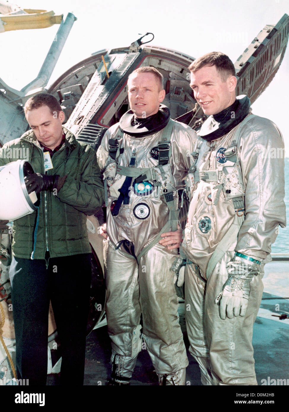 Astronauts Neil A. Armstrong (center) command pilot David R. Scott (right) pilot Gemini 8 prime crew are suited up water egress Stock Photo