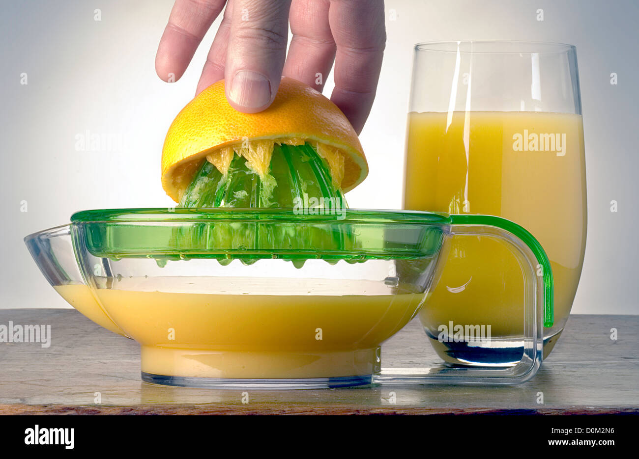 orange juice squeezer with glass Stock Photo Alamy