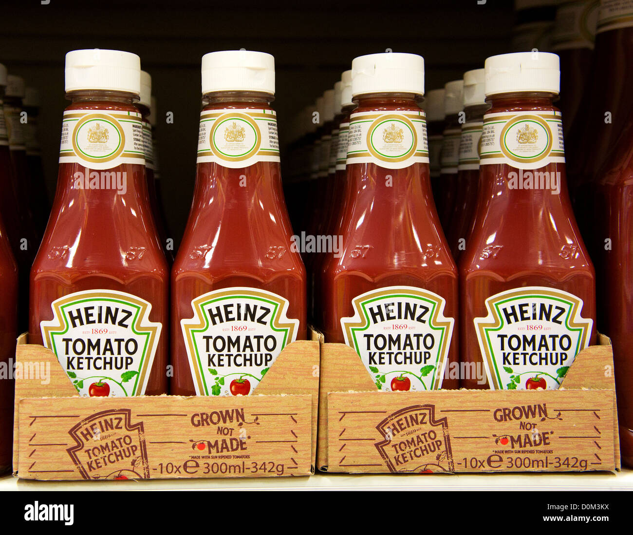 Bottles of Heinz Tomato Ketchup in a UK supermarket Stock Photo