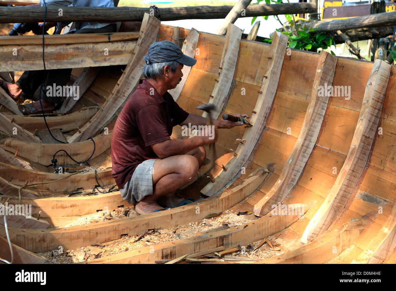 Boat builder on Cam Nam Island, Hoi An, Vietnam Stock Photo