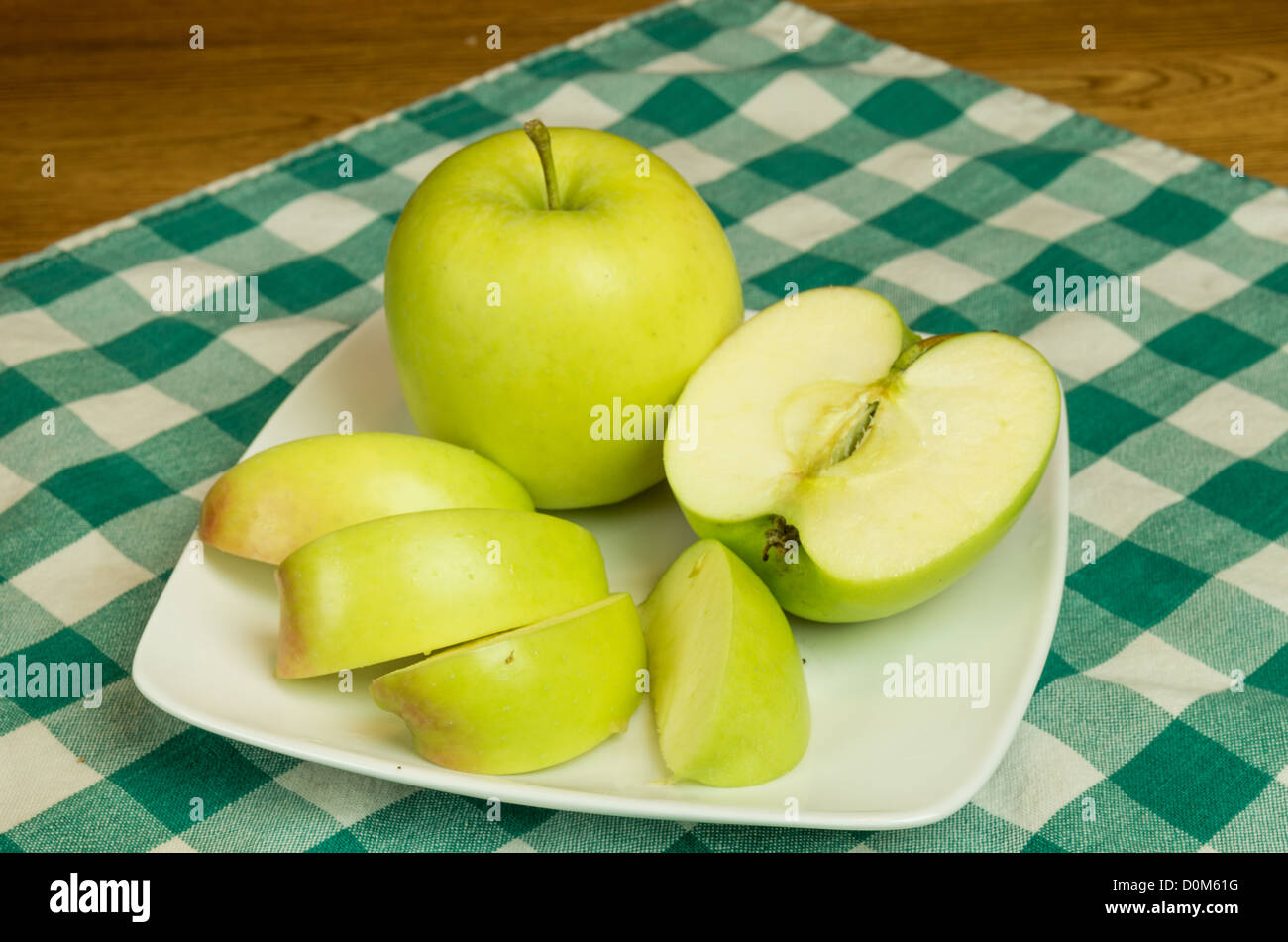 Mutsu apple sliced on white plate Stock Photo
