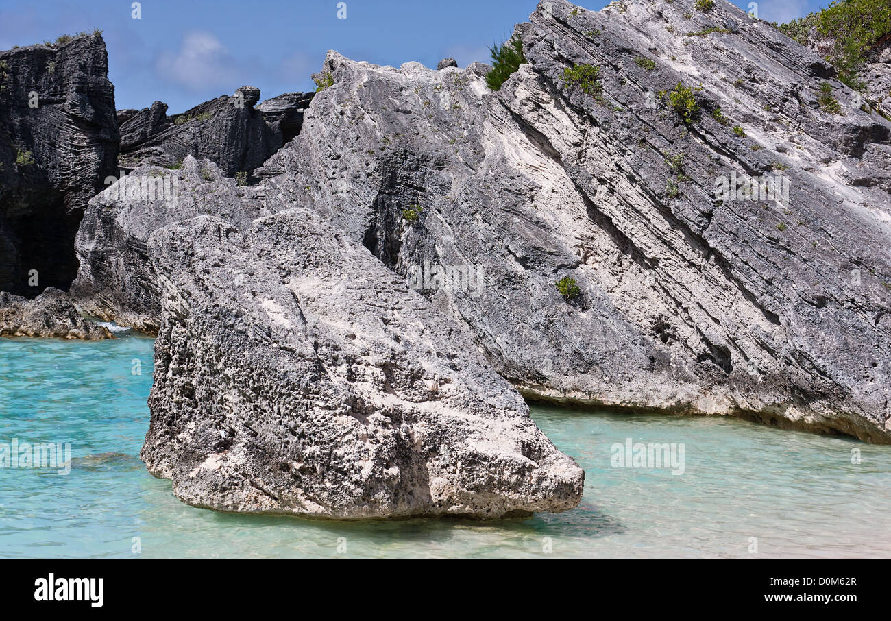 Large rocks, or boulders, in the Atlantic ocean in the coastal waters of Bermuda. Photo was taken at Horseshoe Bay in Bermuda. Stock Photo