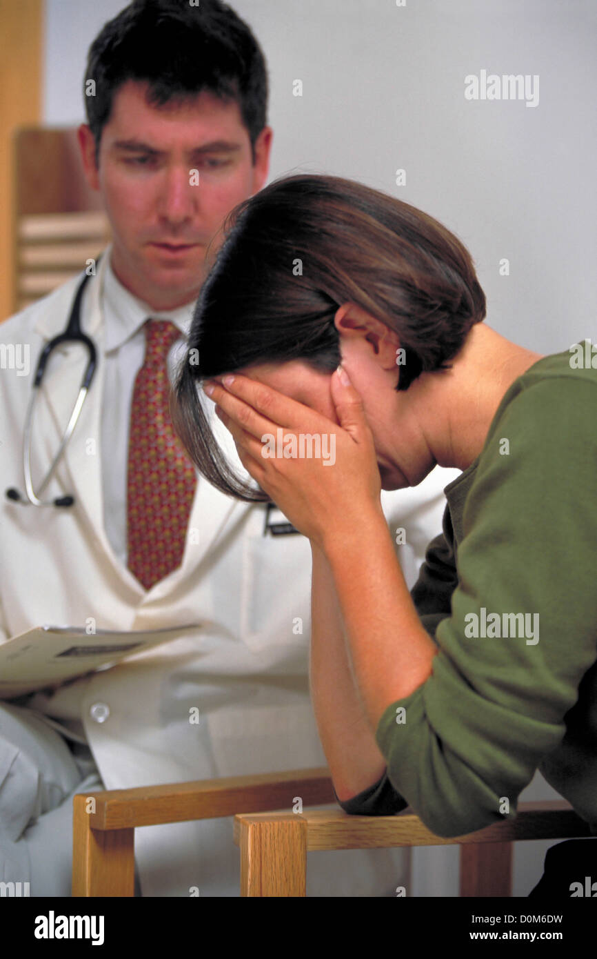 Woman Reacts to Bad News from Physician Stock Photo