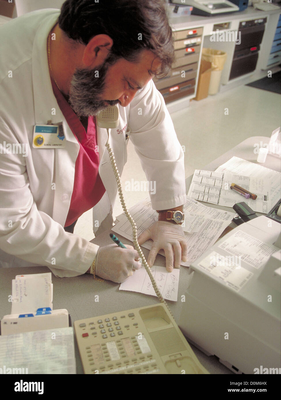 Lab technician on telephone hi-res stock photography and images - Alamy