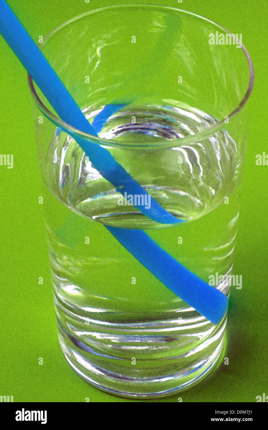 Optical Displacement of Straw in Glass of Water Stock Photo