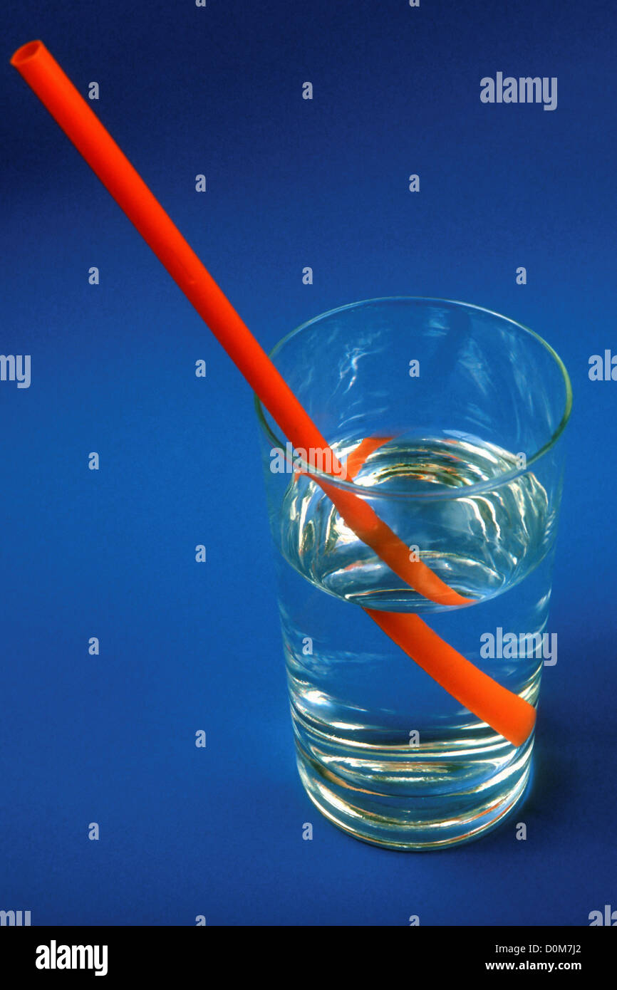 Optical Displacement of Straw in Glass of Water Stock Photo