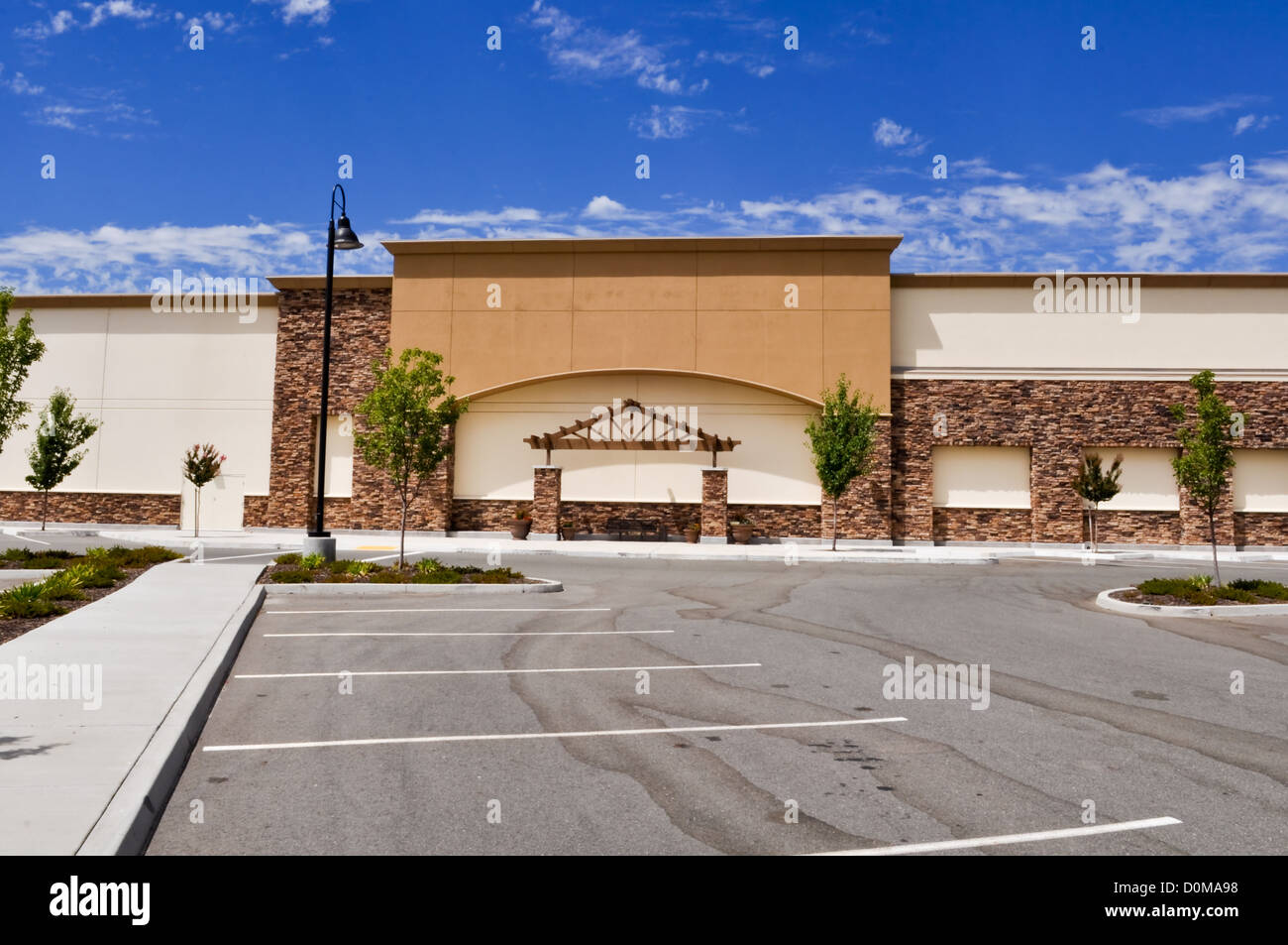 Shopping Center with Parking Lot and Blue Sky Stock Photo - Alamy