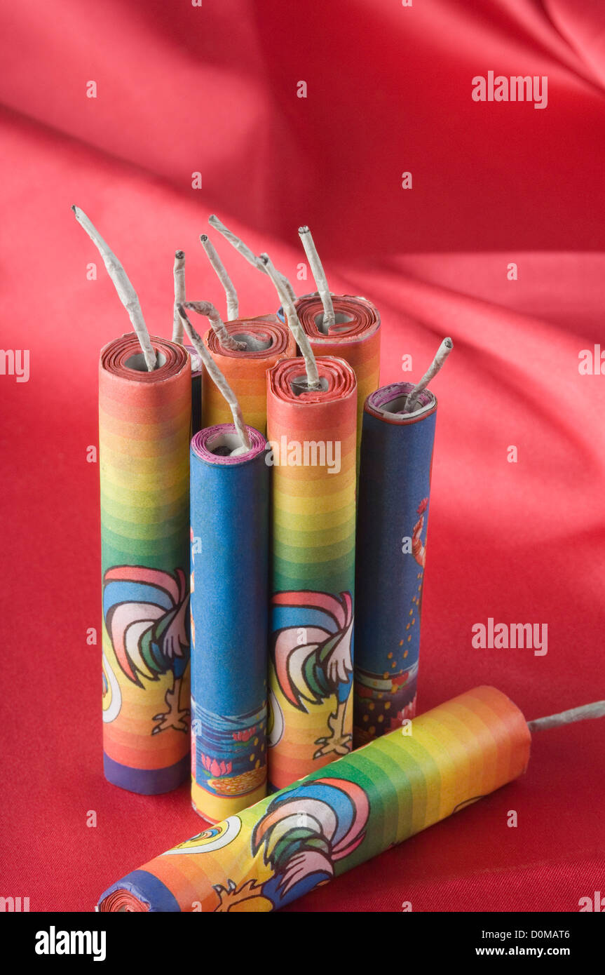 Close-up of firecrackers on a red satin fabric Stock Photo - Alamy