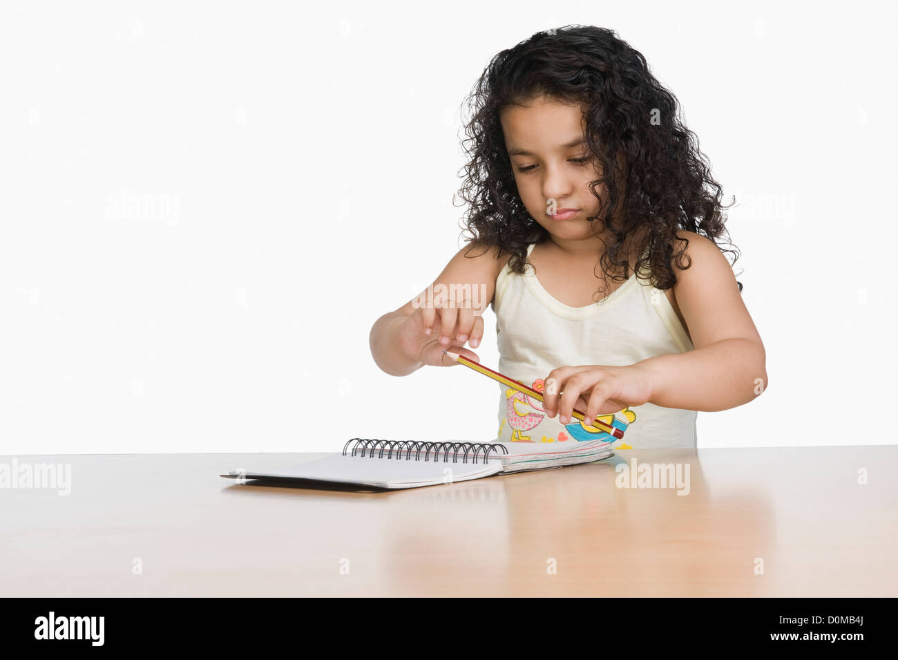 Close-up of a girl holding a pencil Stock Photo - Alamy