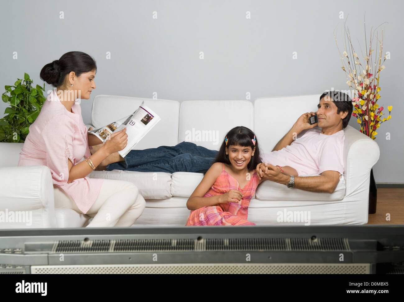 Family involved in different leisure activities Stock Photo Alamy