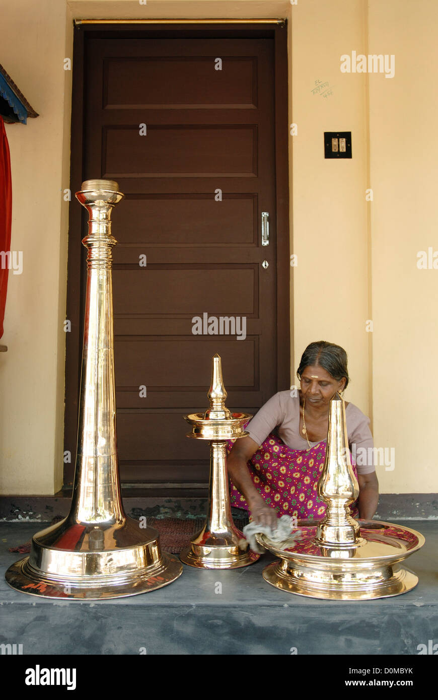 Polishing the brass oil lamp,Kerala, India Stock Photo Alamy