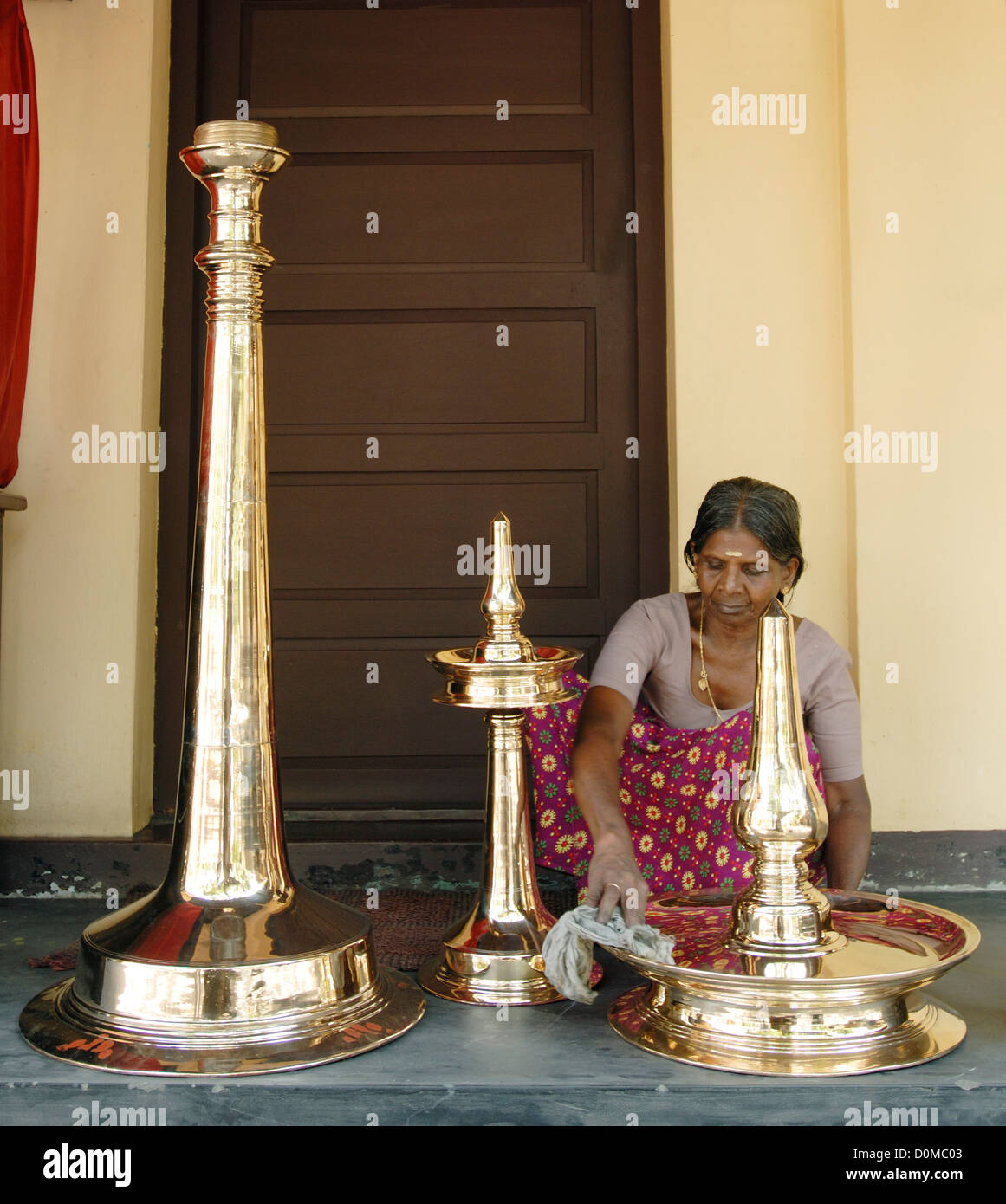 Polishing the brass oil lamp,Kerala, India Stock Photo Alamy
