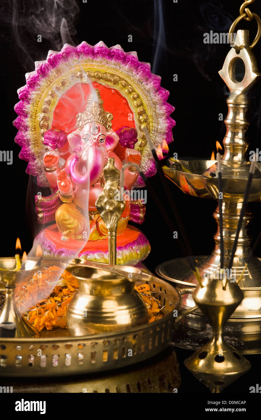 Diwali thali in front of an idol of lord Ganesha Stock Photo