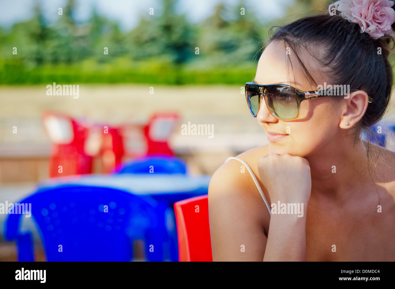 Portrait of attractive young woman with sunglasses - side view Stock Photo