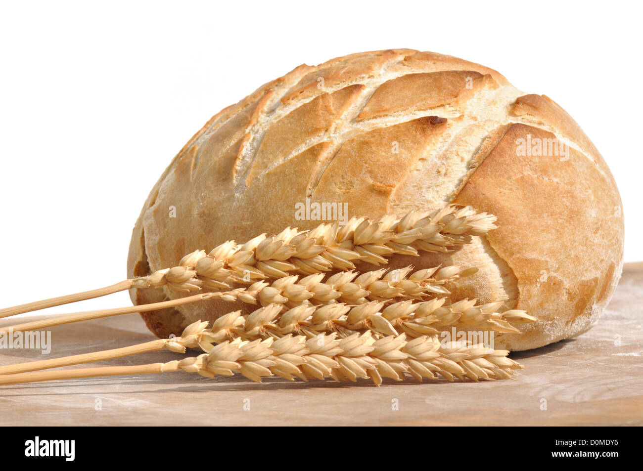 beautiful golden loaf of bread and wheat ears on white background Stock Photo