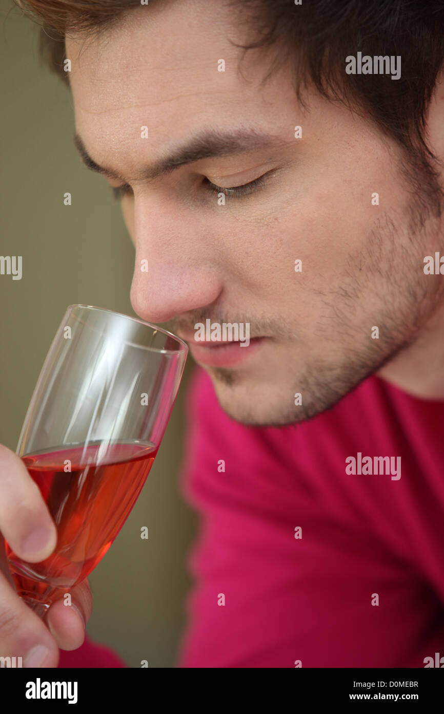 Man smelling glass of wine Stock Photo - Alamy