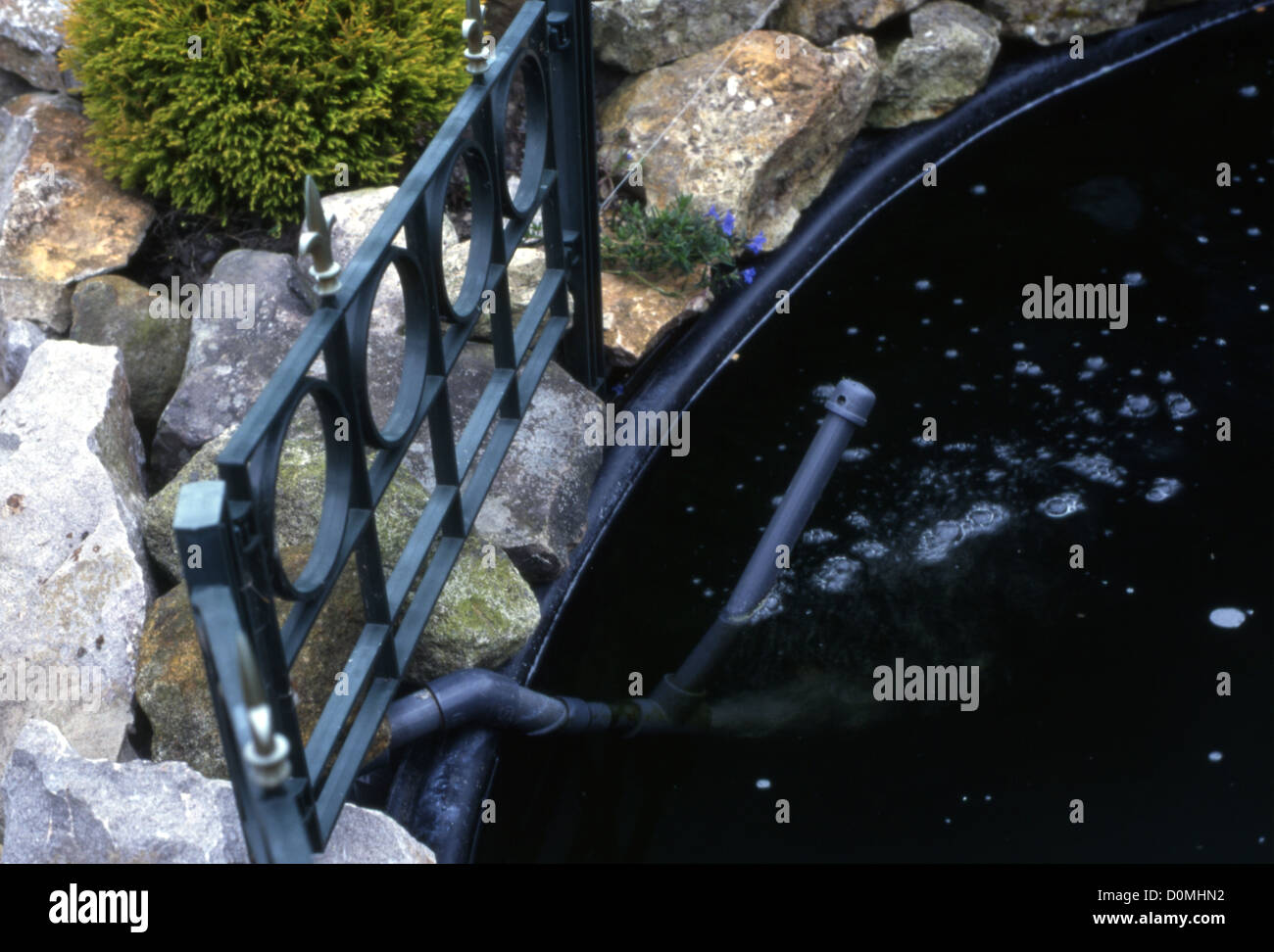 Raised koi pond with homemade venturi for aeration Stock Photo Alamy