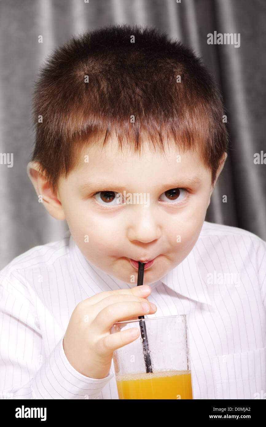 Kid drinking juice Stock Photo Alamy