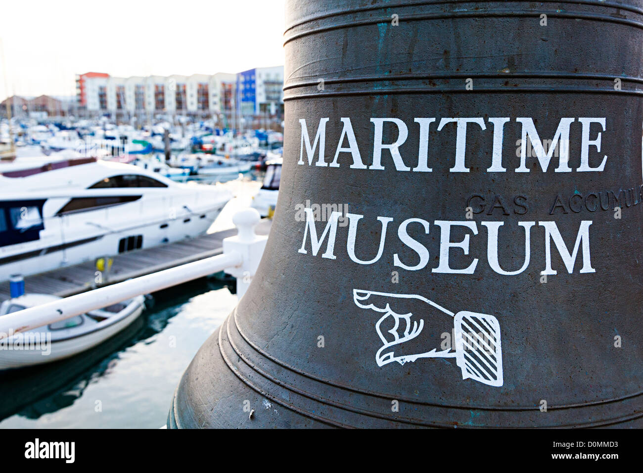 Finger pointer on old bell giving direction to the Maritime Museum at the marina, St Helier, Jersey, Channel Islands, UK Stock Photo