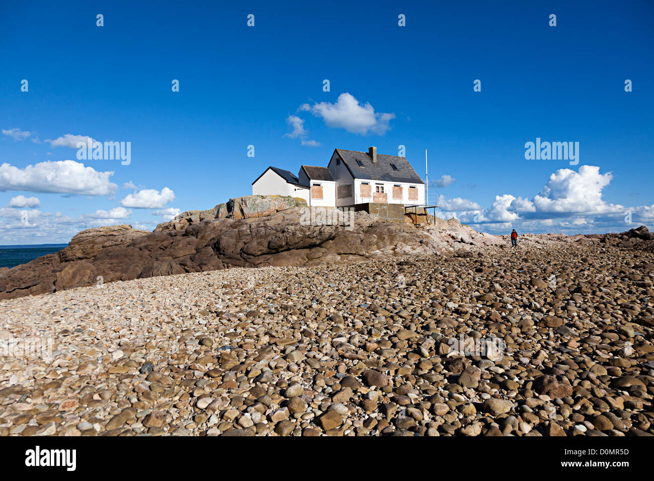 Fisherman's house boarded up against storms Ecrehous island, Jersey, Channel Islands, UK Stock Photo