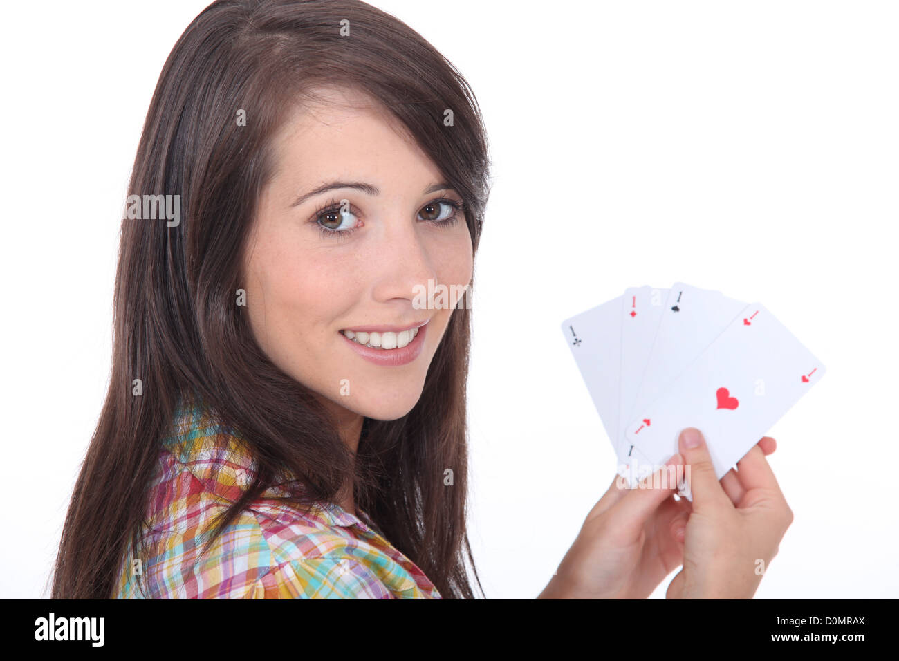 Young brunette with poker cards Stock Photo