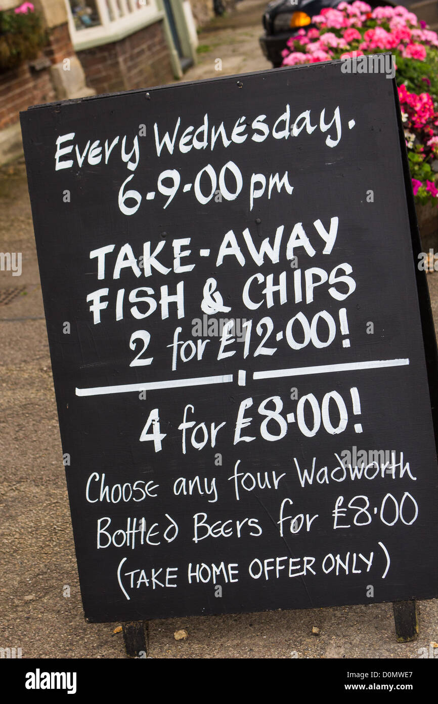 Pub sign England with  invitation for fish and chips UK Stock Photo