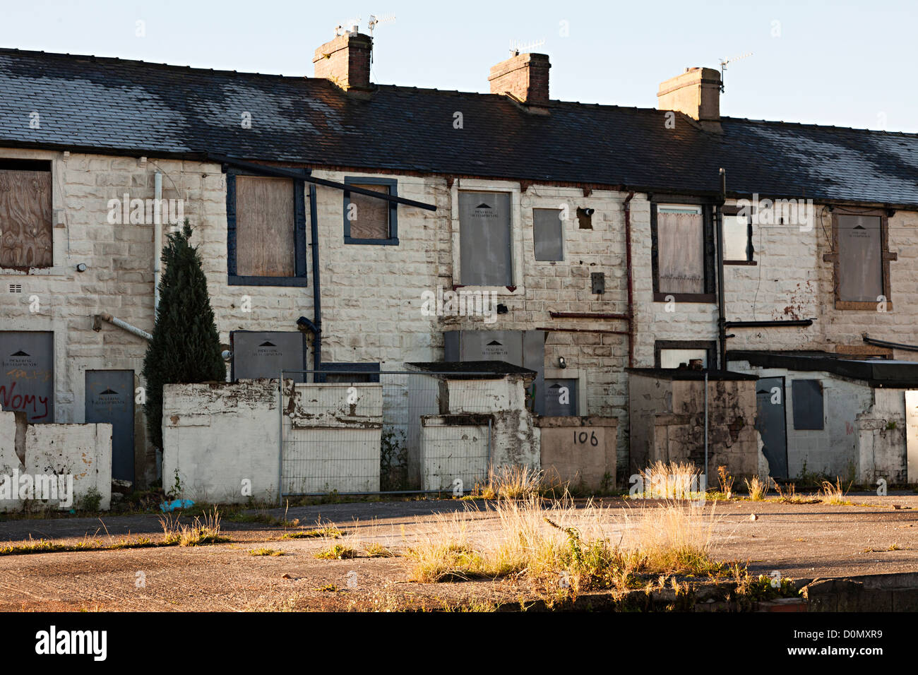 Derelict terraced houses boarded up and awaiting demolition, Burnley