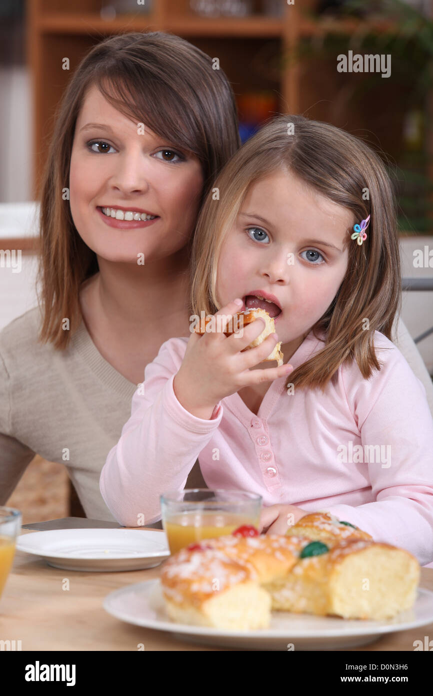 Mother and daughter eating cake Stock Photo Alamy