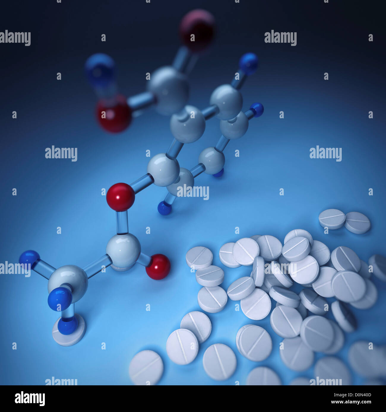 Aspirin or acetylsalicylic acid molecular model next to a pile of
