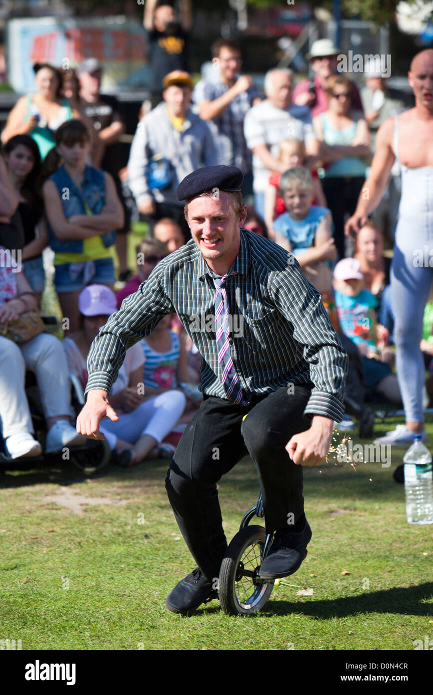 Unicycle antics from clown troop Le Navet Bete at Great Yarmouth's Out There Festival Stock Photo