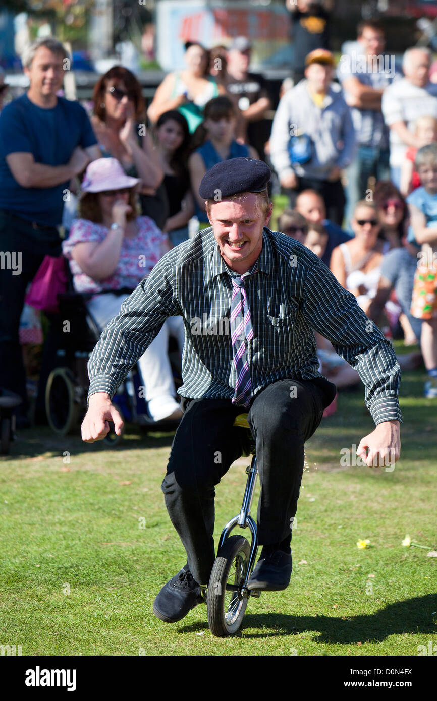 Unicycle antics from clown troop Le Navet Bete at Great Yarmouth's Out There Festival Stock Photo