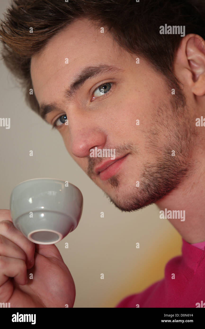 Picture of Man holding espresso Stock Photo - Alamy