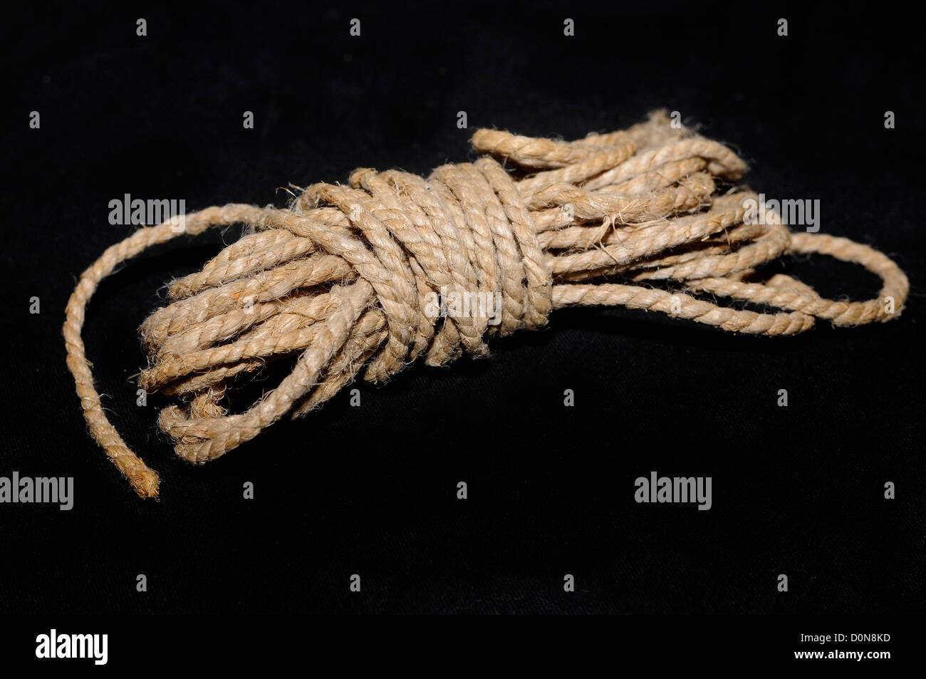 hemp rope,rope, all tied, case closed, ball of string on a black ...
