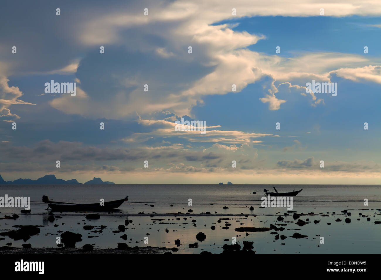 Two boat silhouettes at sunset Stock Photo - Alamy