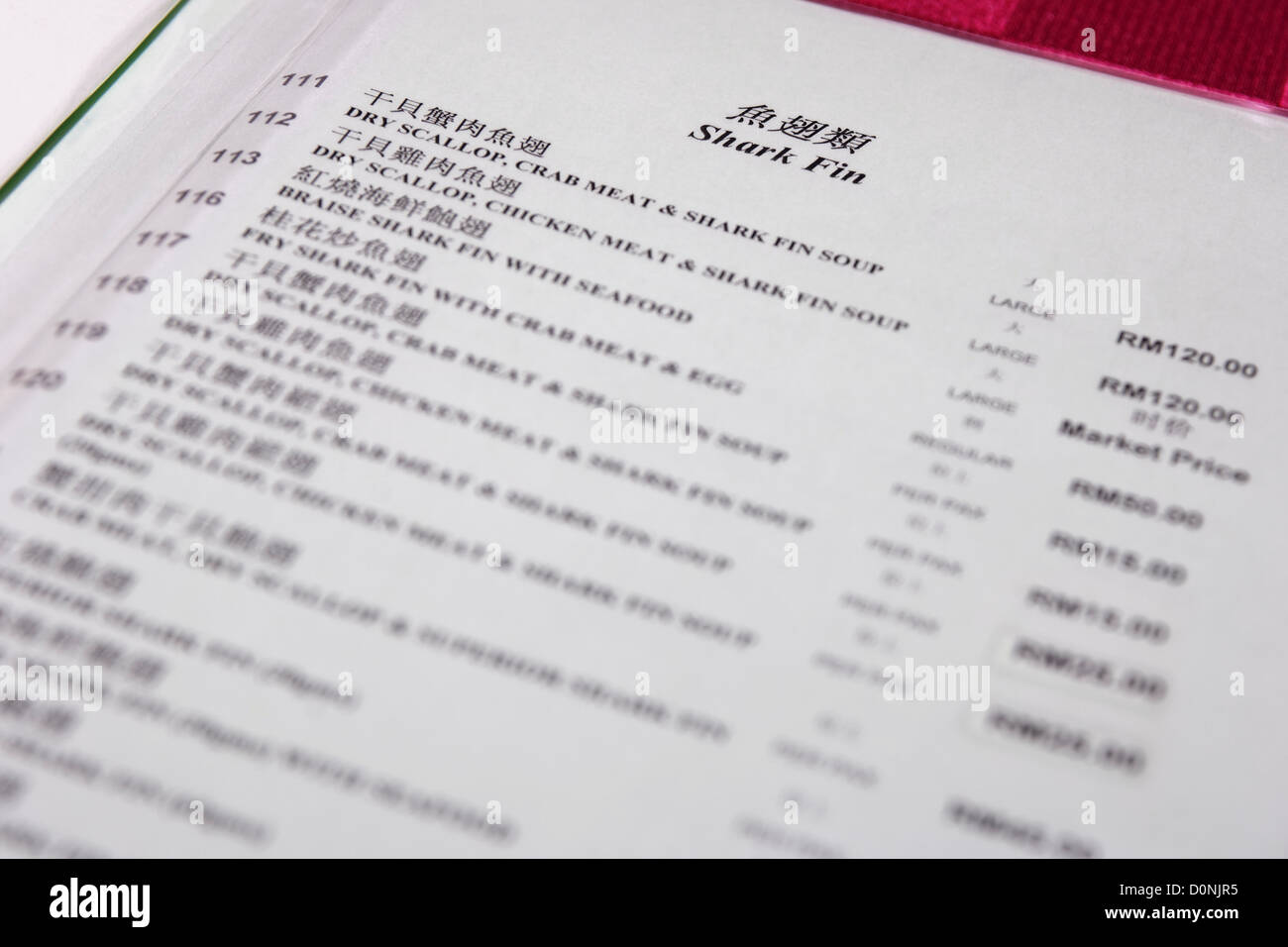 A menu showing shark fin products for sale in a seafood restaurant, Kota Kinabalu, Sabah, Borneo