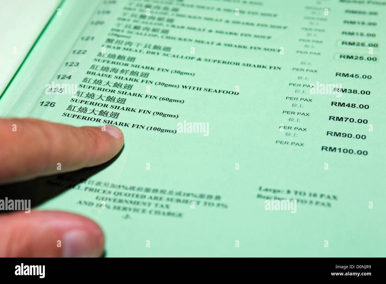A menu showing shark fin products for sale in a seafood restaurant, Kota Kinabalu, Sabah, Borneo