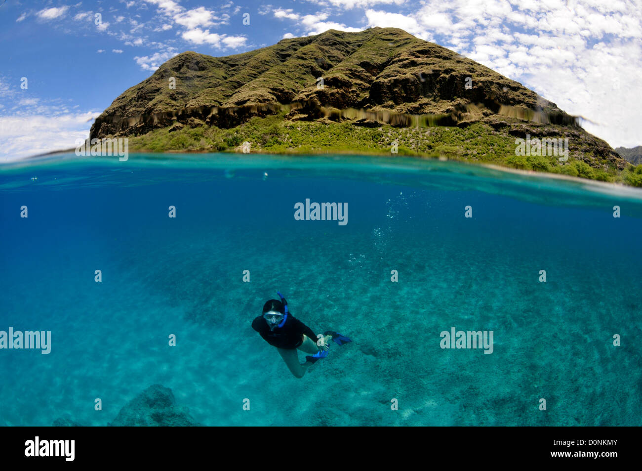Split image of snorkeler and coastal hill, Makua Beach, Oahu, Hawaii, USA Stock Photo