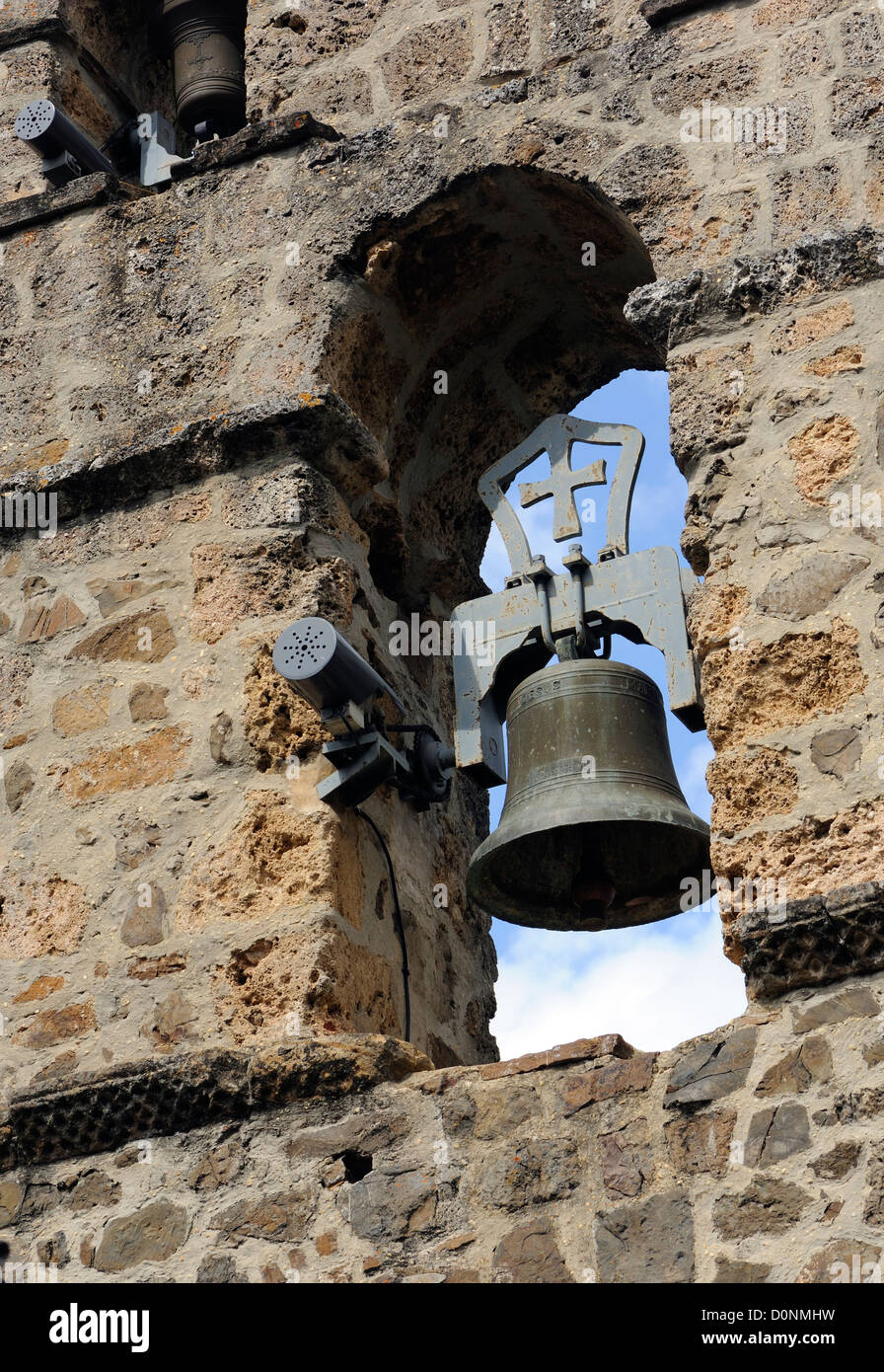 Bell with an electric motor. Monasterio de Santo Toribio de Liébana. Camaleño,  Cantabria, Spain. Stock Photo