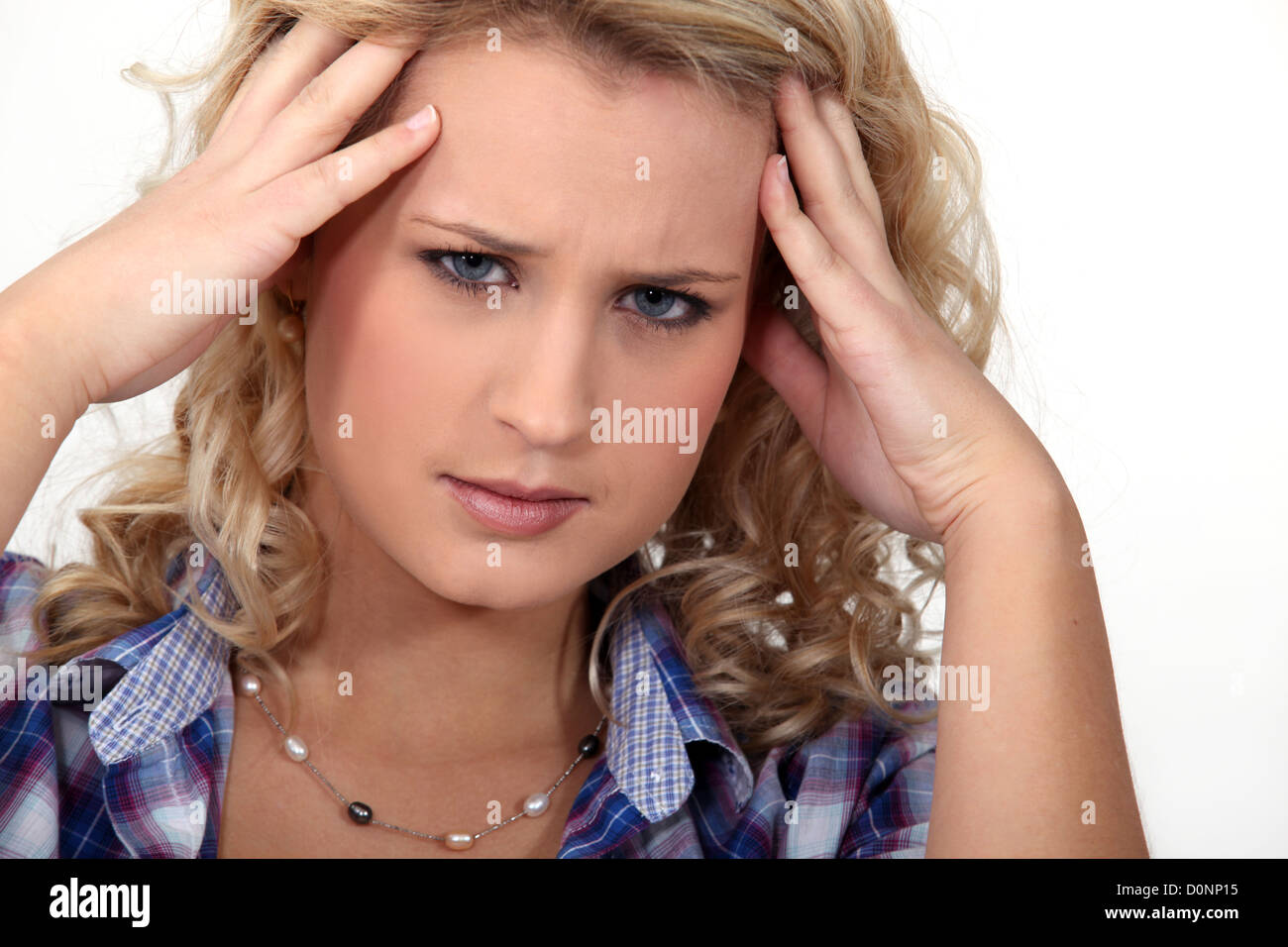 Woman suffering from a throbbing headache Stock Photo