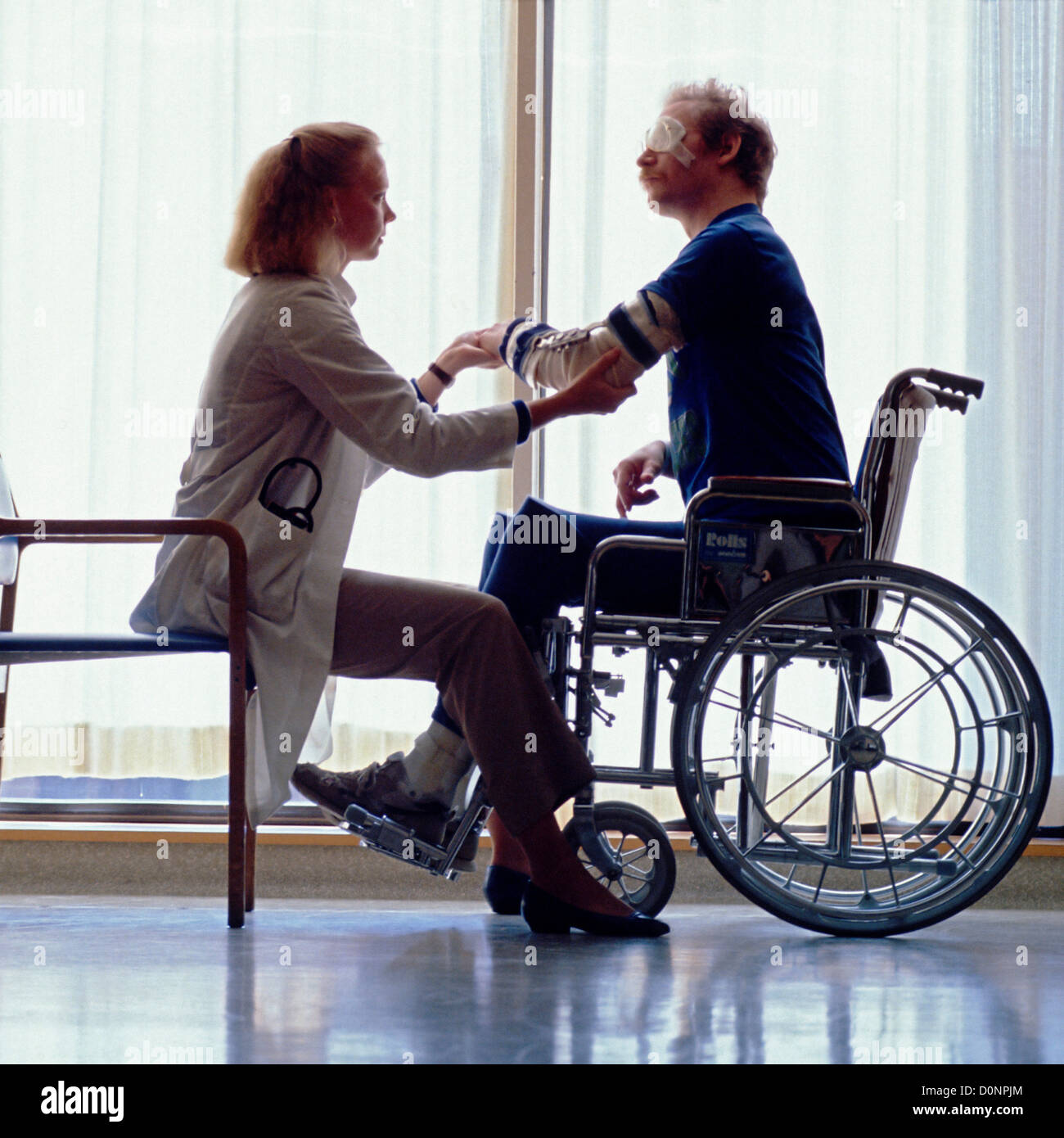 A Wheelchair-Bound Patient is Evaluated for Joint Mobility by a ...