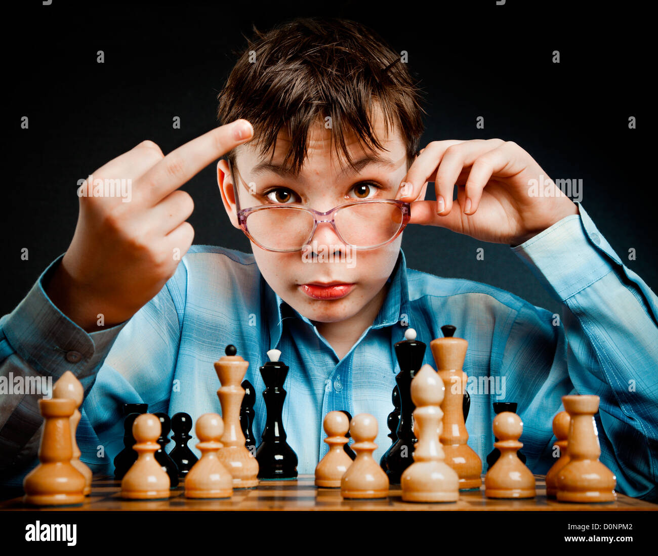 Nerd play chess Stock Photo