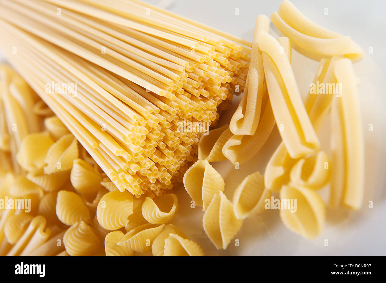 A bunch of wholegrain yellow spaghetti pasta Stock Photo