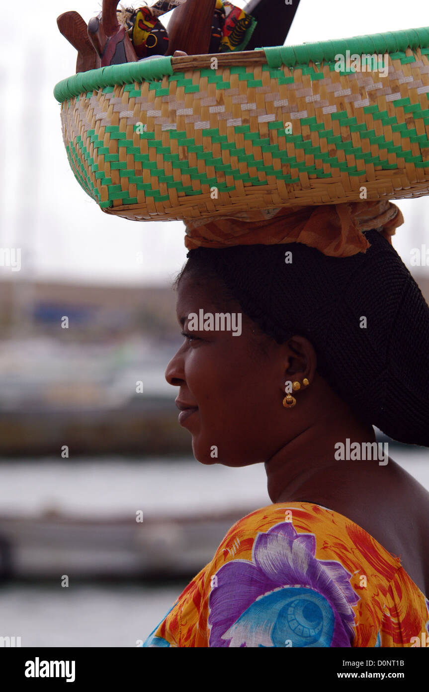 Cape Verdean woman carrying a basket of souvenirs on her head Sal